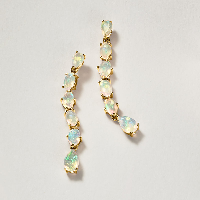 Gold drop earrings with linked opal-like teardrop stones, long U-shaped drop