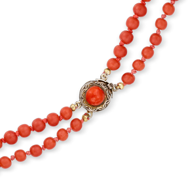 Two-row coral bead necklace with ornate silver-toned clasp and round beads
