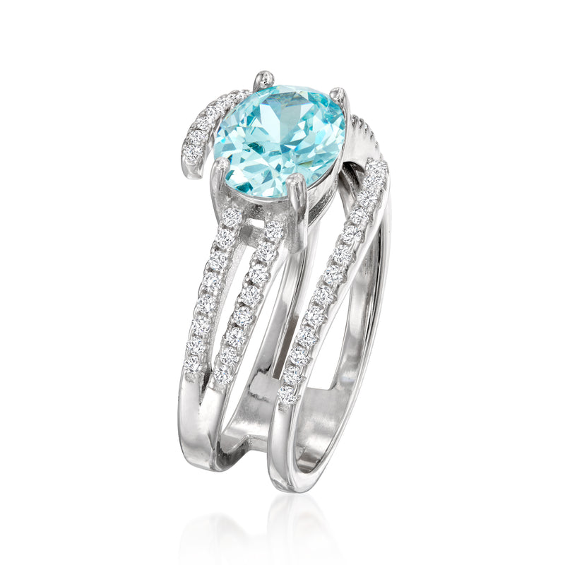 Sterling silver spiral ring with oval simulated aquamarine center stone and CZ accents