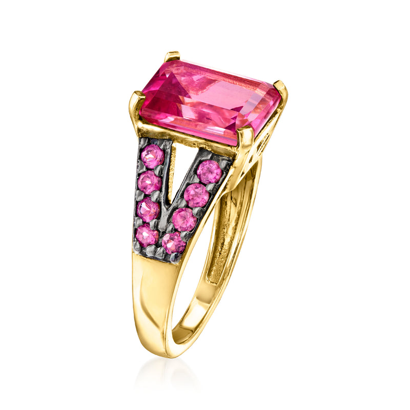 Gold-tone ring with pink rectangular gemstone top and pink stone side clusters