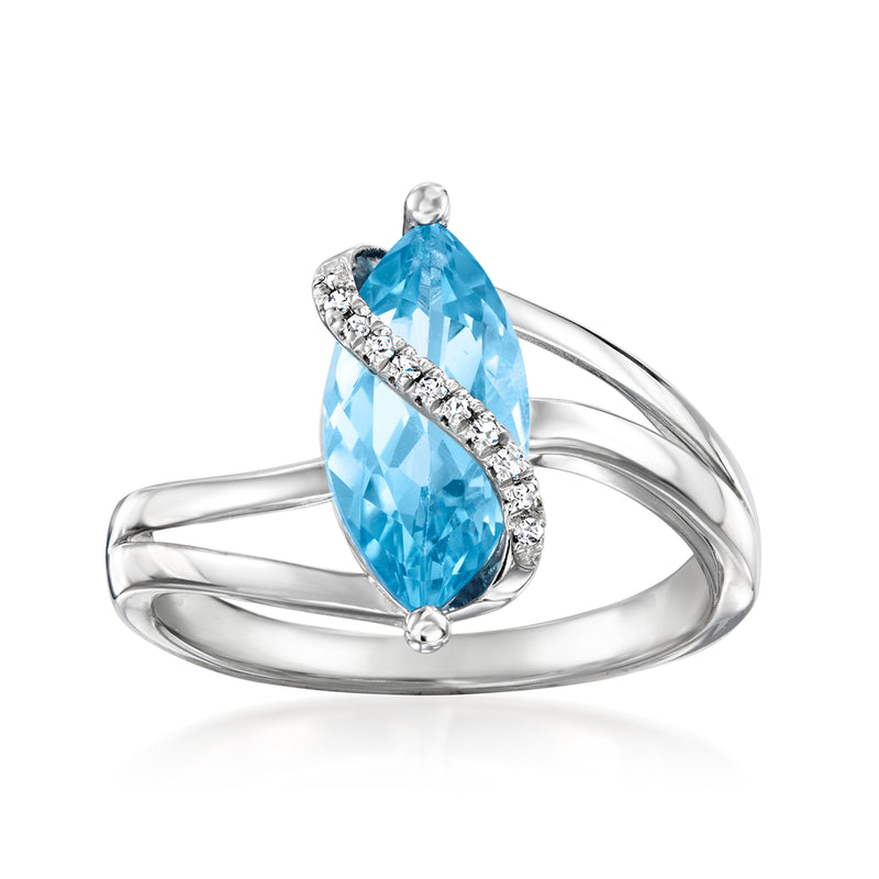 Sterling silver ring with pear-cut blue topaz and diamond pave accents