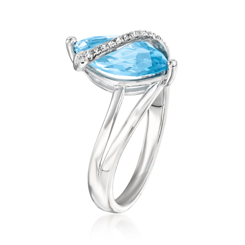 Sterling silver ring with large pear-cut blue topaz and diamond side stones