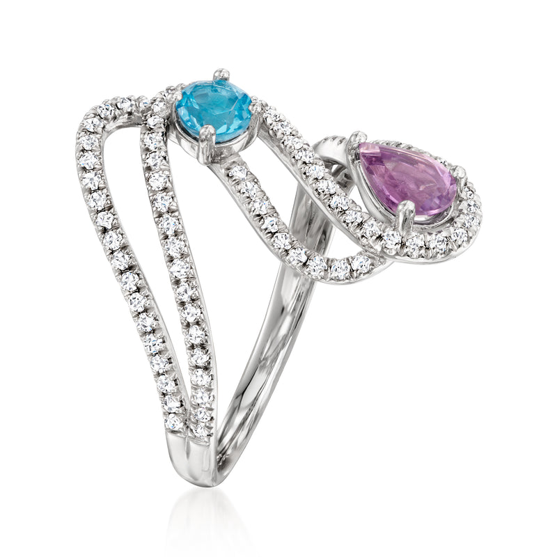 Sterling silver ring with round blue gemstone and teardrop purple gemstone, diamond halo