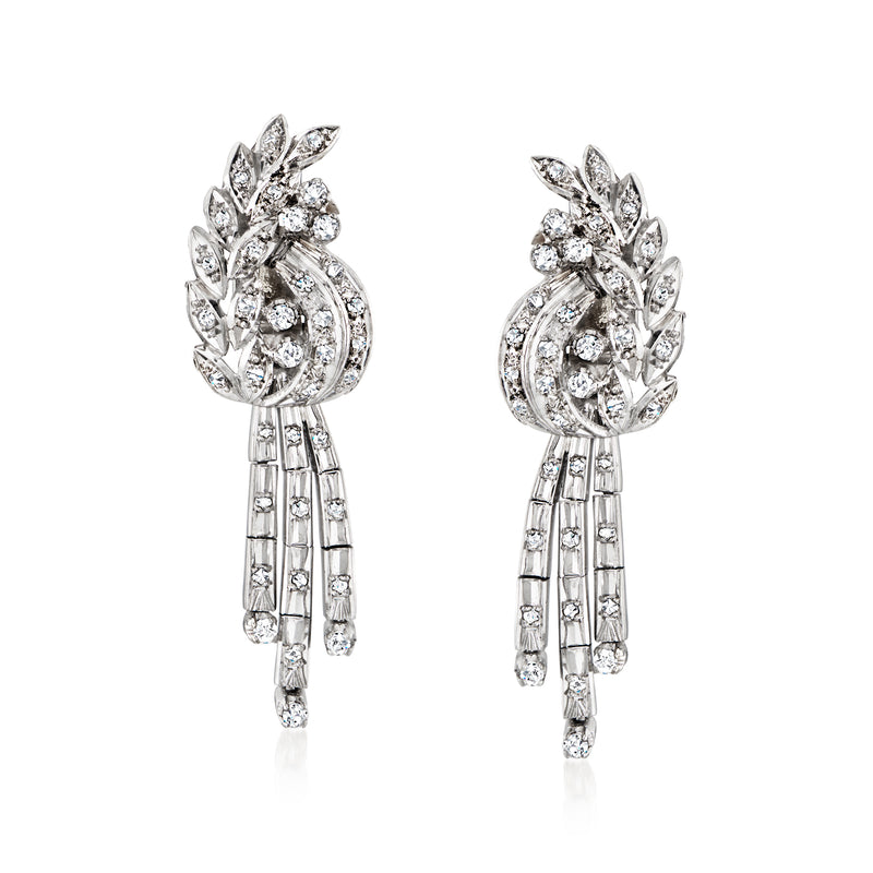 Diamond drop earrings in white gold with floral clusters and dangling baguette accents