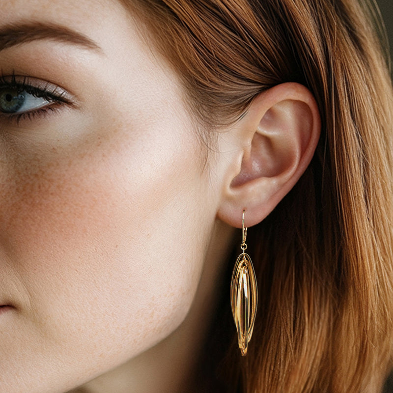 10kt yellow gold oval marquise drop earrings on ear with leverback closure