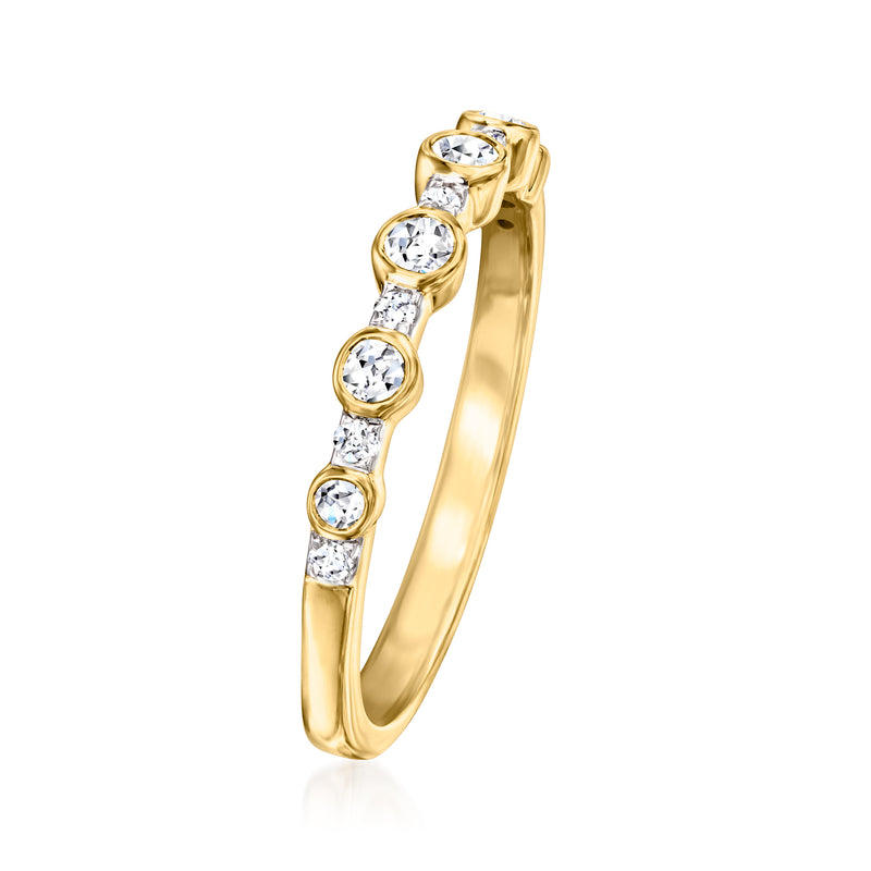 Bezel-set lab-grown diamond band ring in gold with round stones, side view