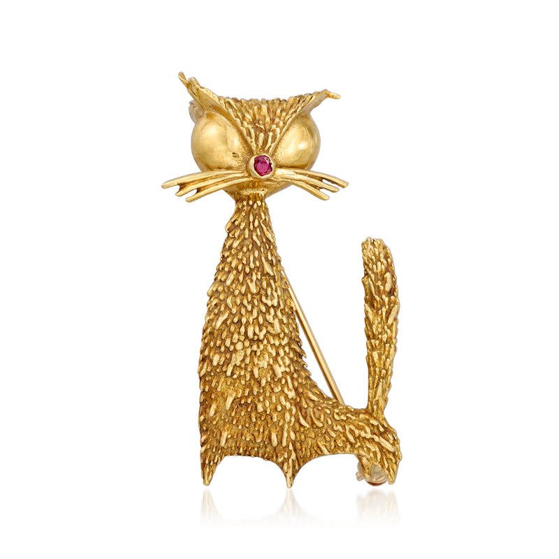 Vintage yellow gold cat pin with single ruby eye, textured openwork design