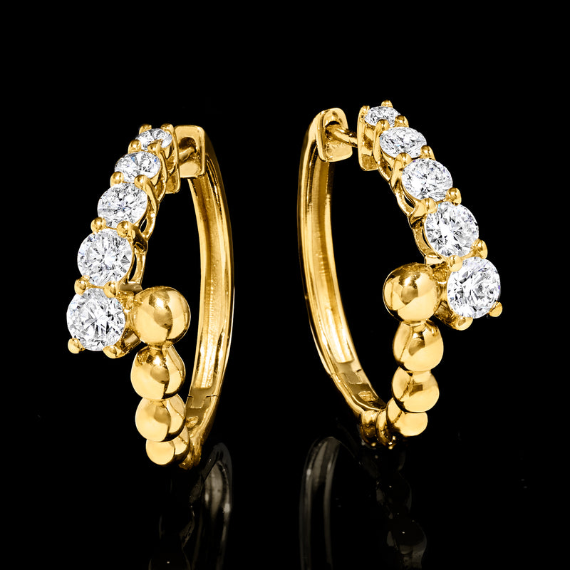 Pair of gold hoop earrings with beaded bypass and round diamond-like stones
