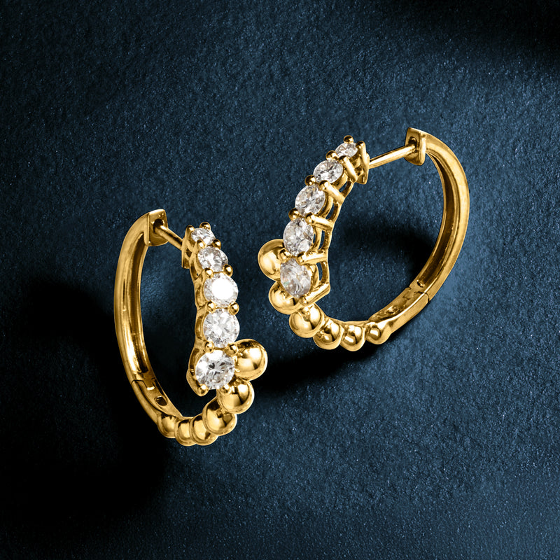 Gold beaded bypass hoop earrings with multiple round diamond-like stones