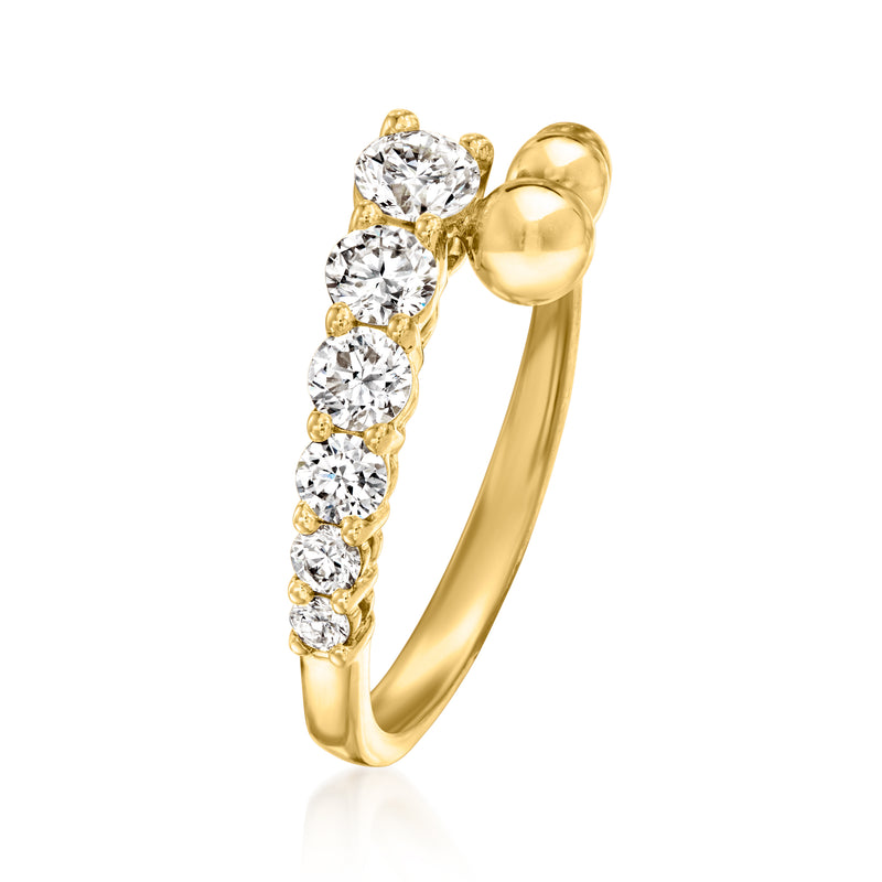 Gold bypass ring with stacked round diamond stones and curved beaded shoulders