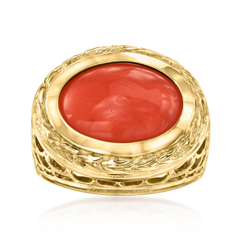 Vintage coral ring in 14kt yellow gold with oval red cabochon and ornate gold band