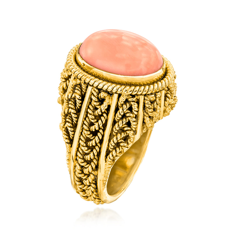 Vintage oval coral cabochon ring in 14kt yellow gold, braided wrap design