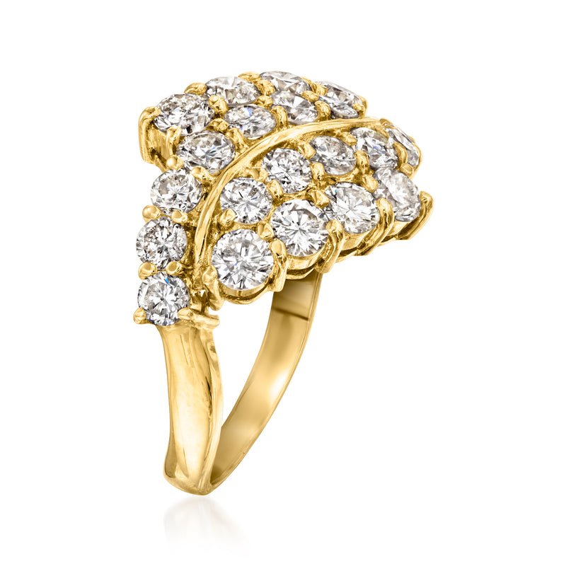 Yellow gold diamond cluster ring, angled view showing prong-set round diamonds