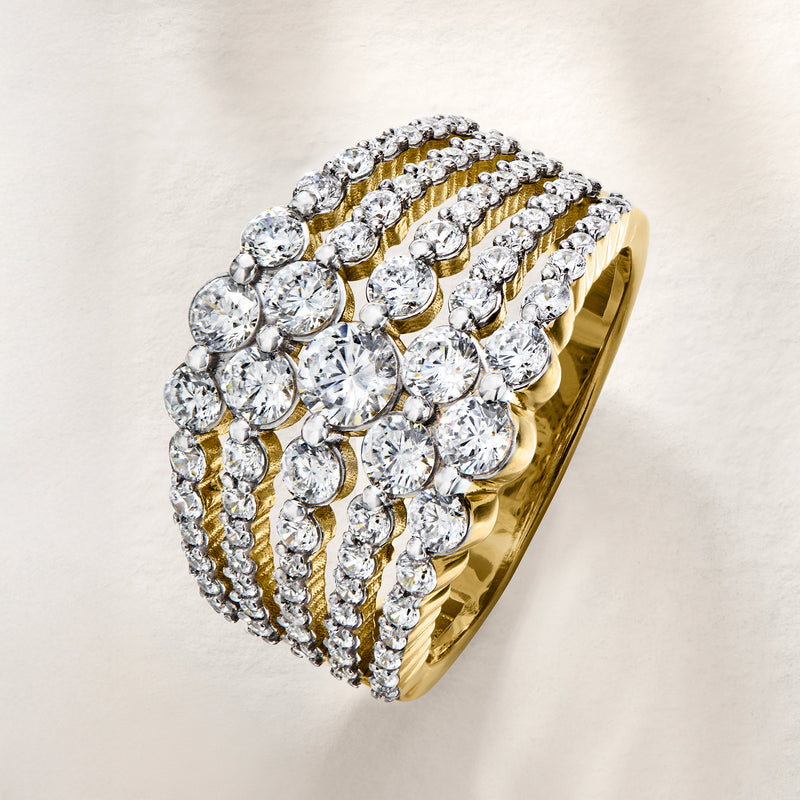Gold-tone multi-row CZ ring with round clear stones and gold accent rows