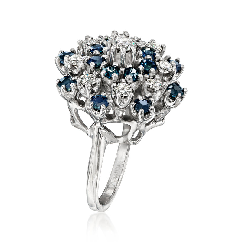 White gold cluster ring with blue sapphire stones and diamond accents, side view