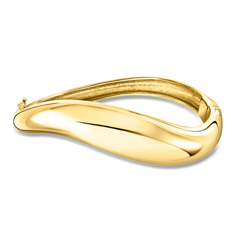 Gold-over-sterling sculptural bangle bracelet with polished oval shape and end clasp