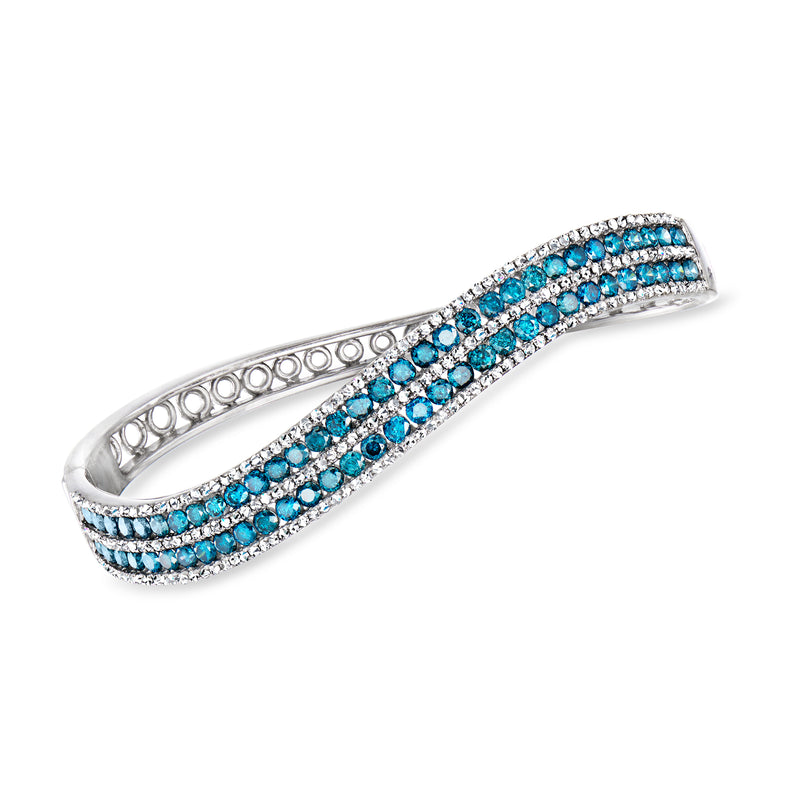 14kt white gold bangle bracelet with blue and clear diamond-like stones