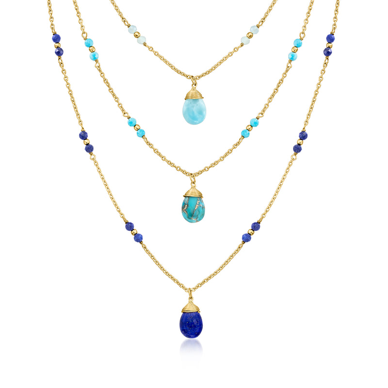 Layered gold-tone three-strand necklace with blue and turquoise gemstone drops
