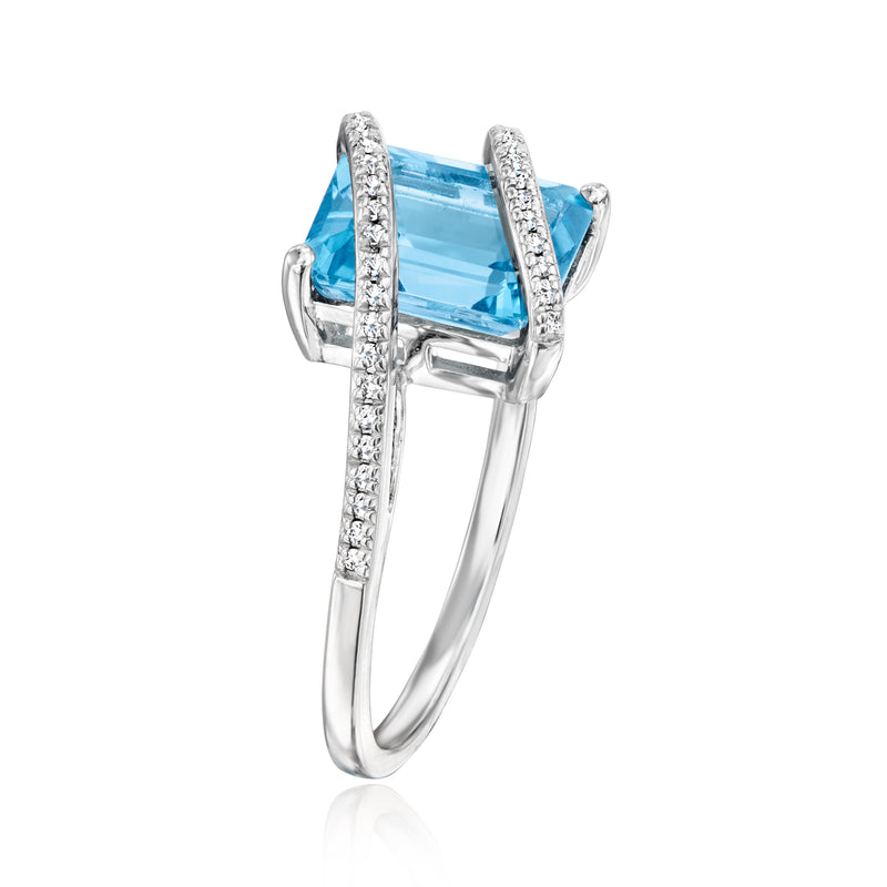 Sterling silver ring with square blue topaz in prong setting and diamond halo