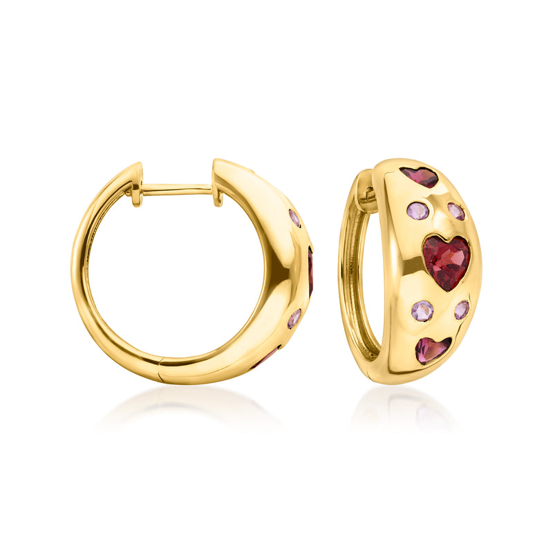 Gold hoop earrings with colorful heart-shaped gemstone accents on hinged oval hoops