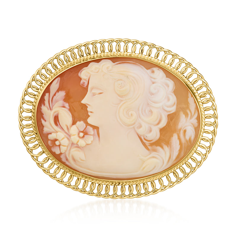 Oval cameo pin/pendant in 14kt yellow gold with left-facing profile on orange shell
