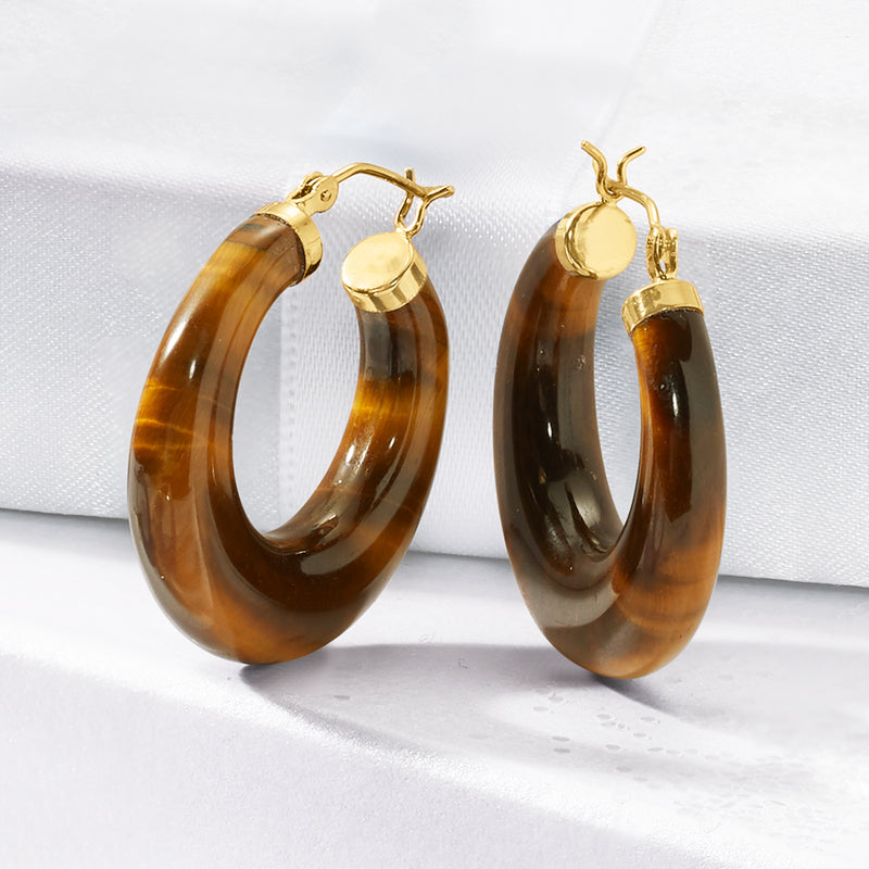 Tiger eye hoop earrings in 14kt yellow gold, textured brown oval hoops with clasp.
