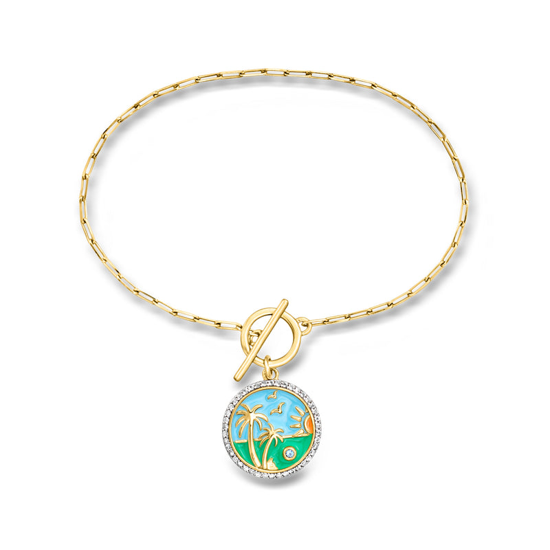 Gold-tone toggle bracelet with round beach enamel charm and blue gemstone, hinged clasp