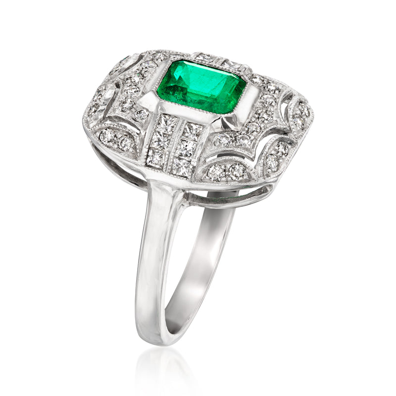 White gold ring with square green gemstone center and diamond side detailing
