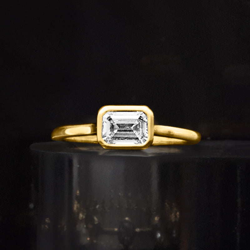 14kt yellow gold ring with emerald-cut diamond, front close-up