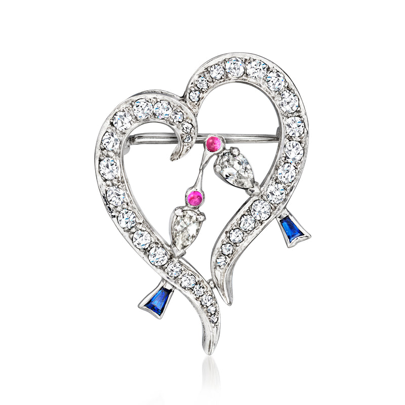 Platinum heart pin with diamond, ruby, and sapphire accents
