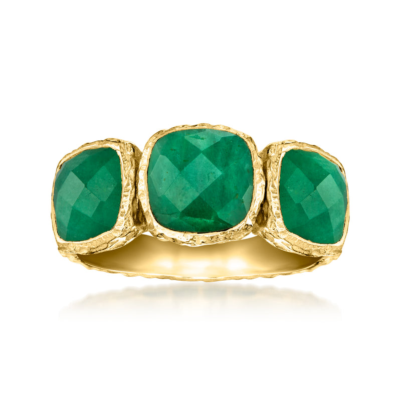 Three-stone bezel-set emerald-green gemstone ring with textured gold-tone band