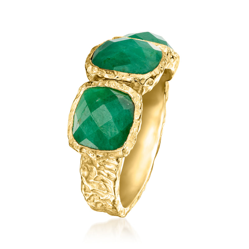 Three-stone emerald-green bezel ring with textured gold band, side view