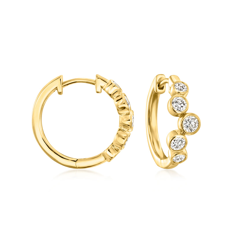 Gold hoop earrings with round bezel-set diamonds in a bubble style