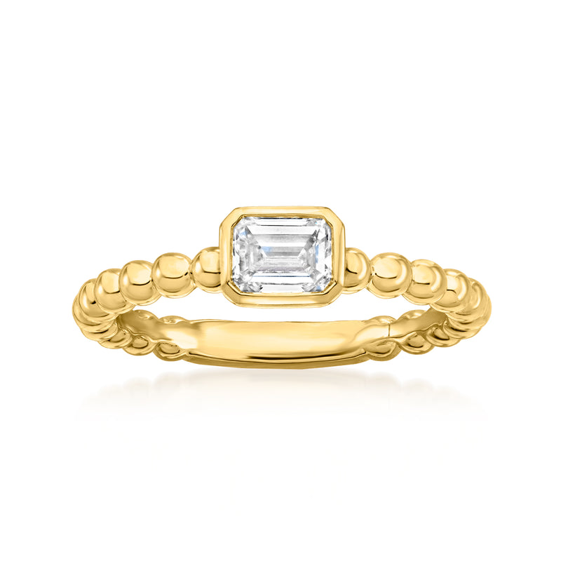 Gold beaded ring with emerald-cut clear center stone