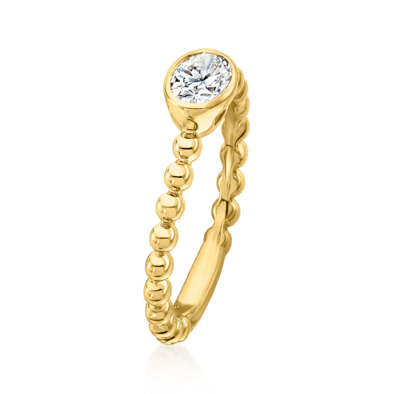 Gold beaded oval diamond ring, side view with round bead accents