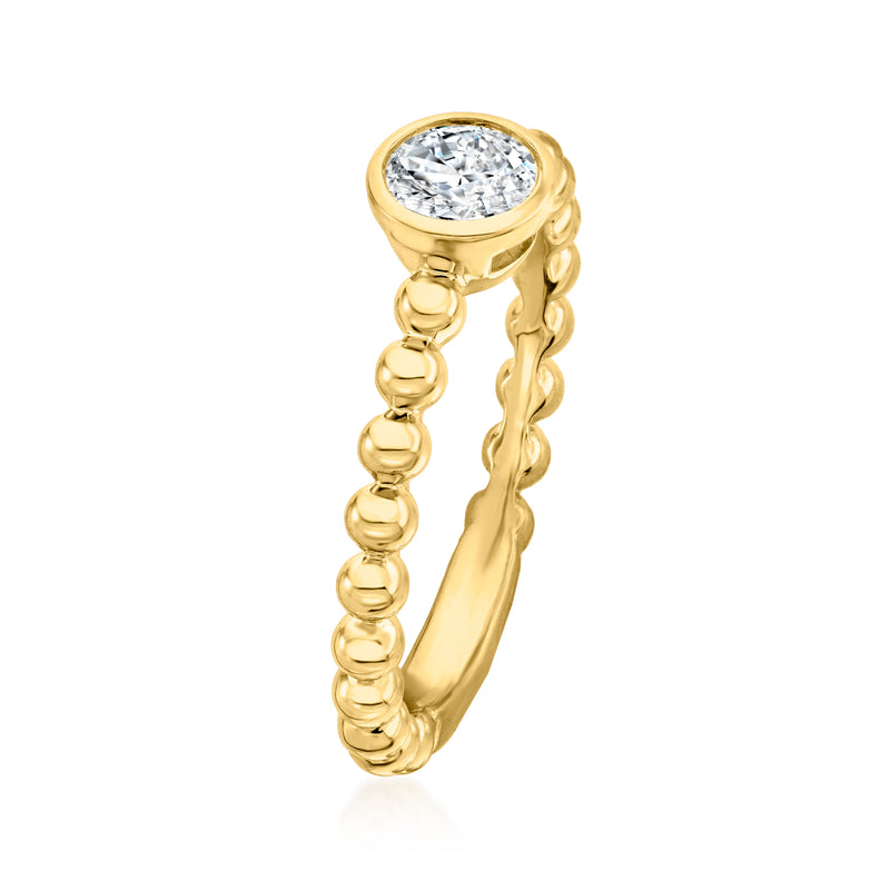 Gold beaded band ring with round diamond cluster setting, side view