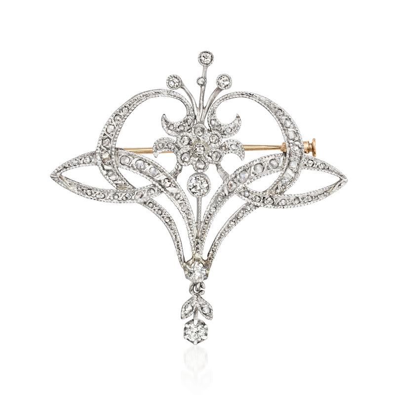 Vintage diamond pin with openwork scrolls, round stones, teardrop center, platinum and gold