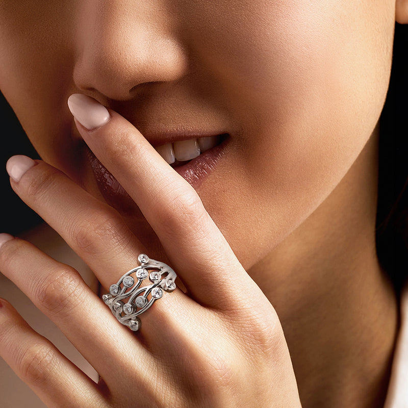 Sterling silver vine CZ ring with round stones on finger, openwork design