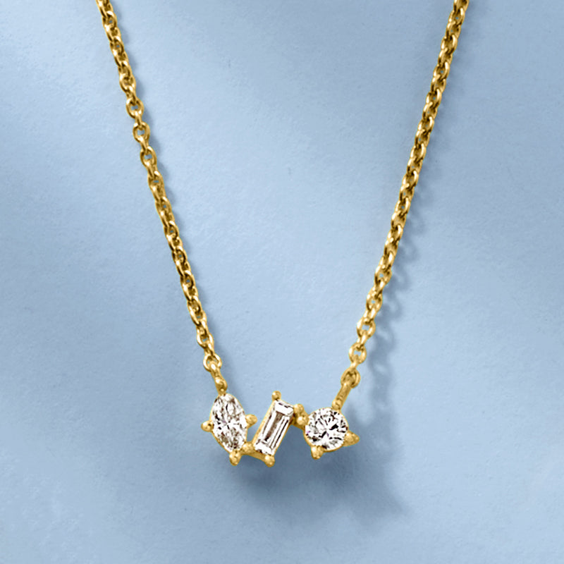 Gold diamond necklace with multi-shaped three-stone pendant on curb link chain