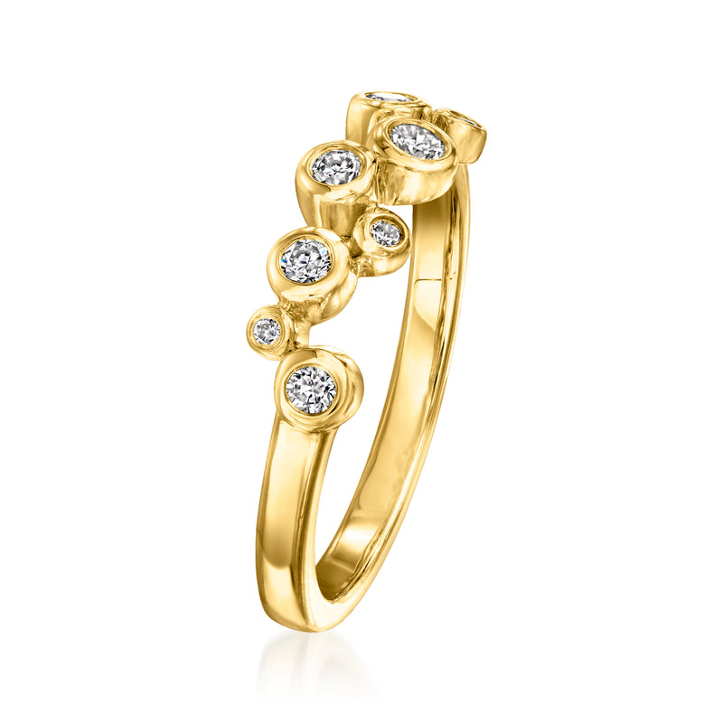 Gold zigzag diamond ring with round bezel-set stones along the band