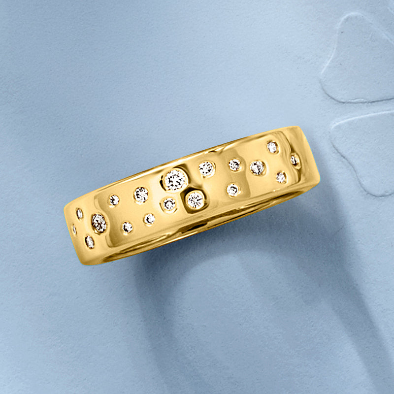 Gold over sterling wide band ring with scattered round diamonds, angled view