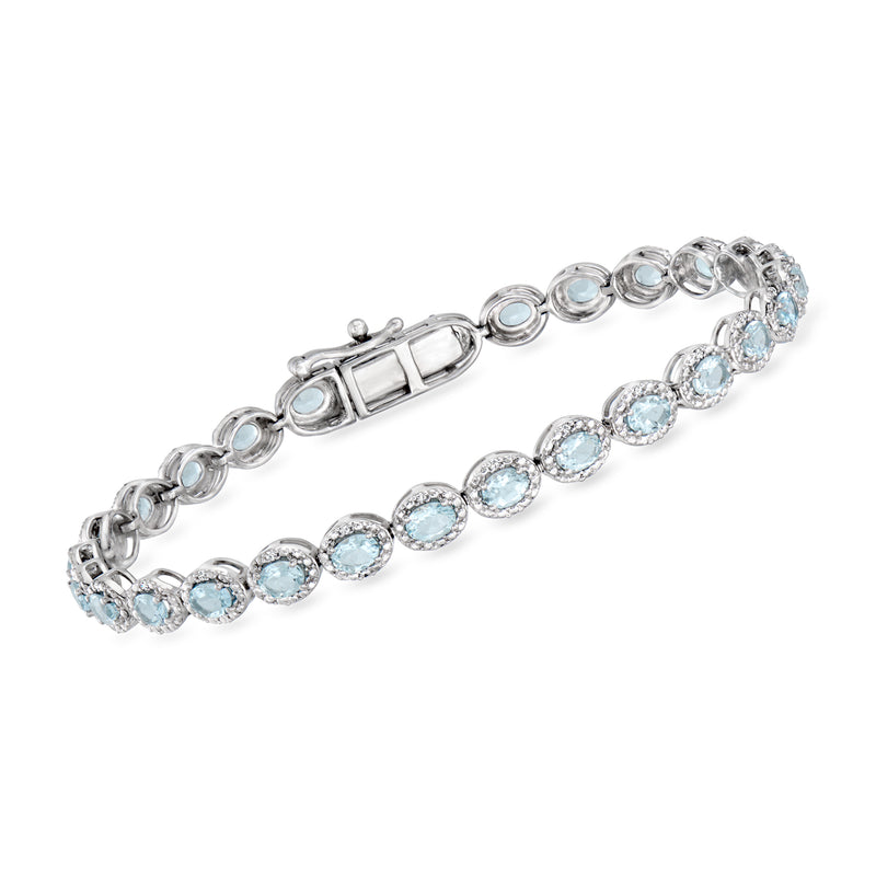 Sterling silver tennis bracelet with oval aquamarine and diamond accents, hinged clasp
