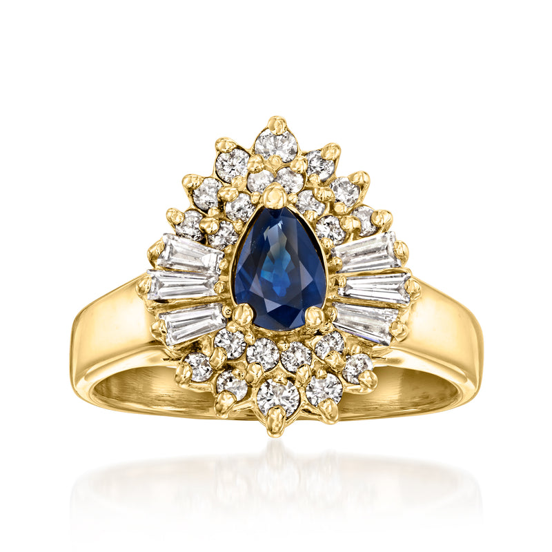 14kt yellow gold ring with oval blue sapphire center and diamond halo, baguette accents