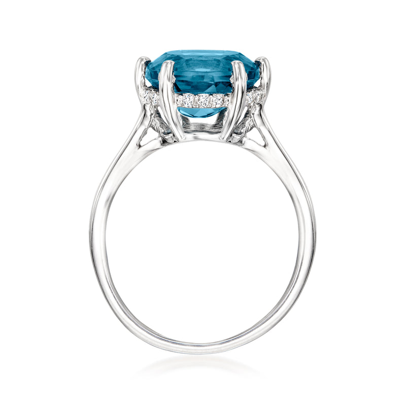 Sterling silver ring front view with oval blue topaz and diamond side accents in four prongs