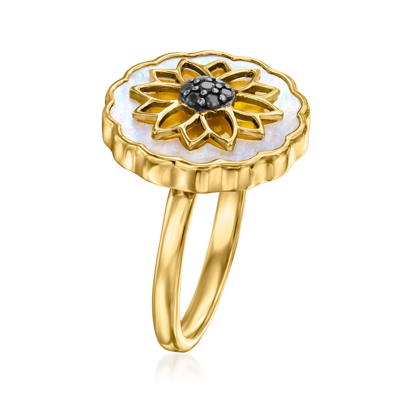 Gold-tone flower ring with mother-of-pearl background and black gemstone cluster, side view