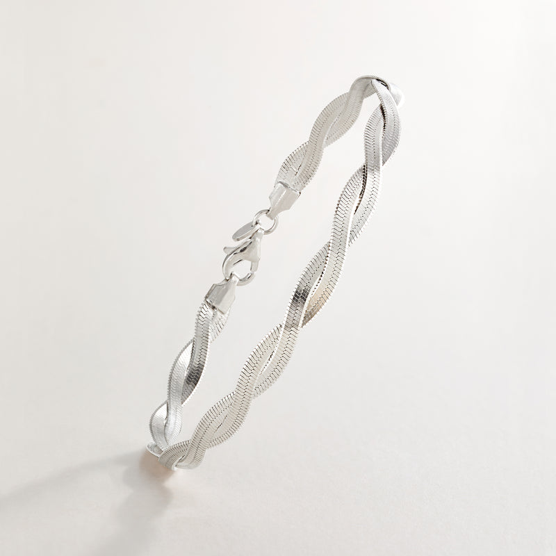 Sterling silver twisted herringbone bracelet shown from the side with clasp