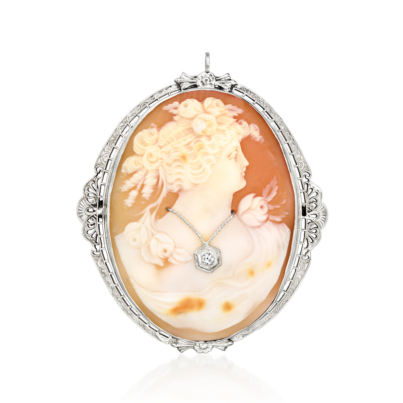 Oval orange shell cameo pendant with single diamond set in 14kt white gold