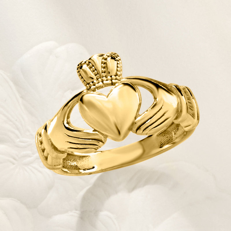 Gold over sterling Claddagh ring angled view, heart front with crown and hand detailing