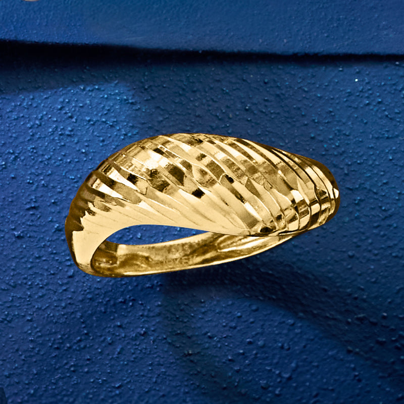 Gold-tone ribbed sculptural ring with diamond-cut facets on band