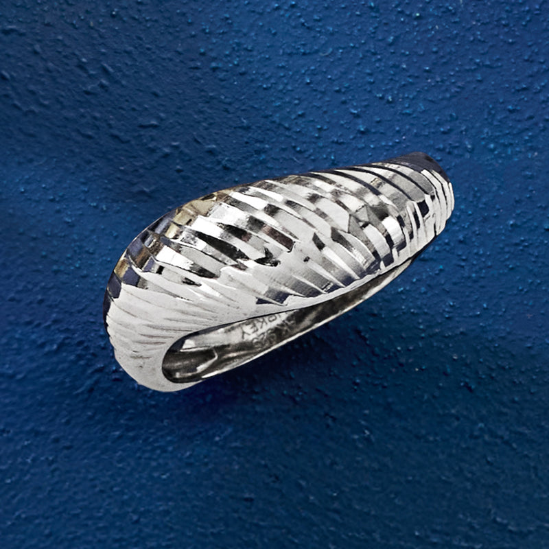 Sterling silver sculptural ring with diamond-cut ridges and polished inner band